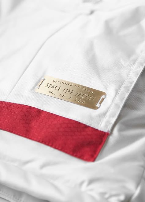 Spacelife Patch // SPACELIFE Unveils Limited Edition Astronaut Jacket Astronaut Jacket, Tag Design Ideas, Sportswear Details, Metal Tags, Space Suit, Leather Label, Clothing Details, Garment Labels, Metal Trim