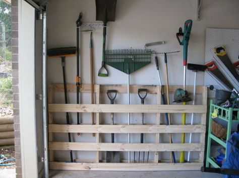 Make your rakes easy to grab when you need to clean up some autumn leaves by nailing old pallets to your garage wall. | 7 Easy Organizing Tricks You'll Actually Want To Try Rinnovo Garage, Rifacimento Garage, Officine In Garage, Shed Organization, Garage Storage Solutions, Tool Storage Diy, Garage Organize, Garage Remodel, Garage Shed