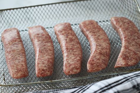 air fry brats laying on a cooking sheet before cooking Italian Sausage In Air Fryer, Sausage Air Fryer, Air Fryer Italian Sausage, Sausage In Air Fryer, Air Fryer Brats, How To Cook Bratwurst, Italian Sausage Recipe, Whole Lotta Yum, Grilled Brats