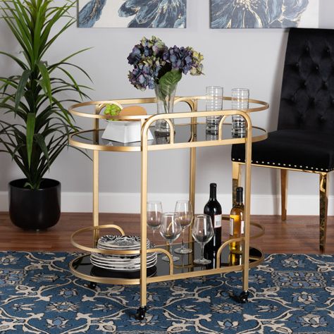 Everly Quinn Olympie Baxton Metal and Tempered Glass 2-Tier Bar Cart | Wayfair Black And Gold Bar, Raised Borders, Bar Cart Inspo, Shaped Shelves, Affordable Dining Room Sets, Wine Cart, Metal Bar Cart, Gold Bar Cart, Drink Cart