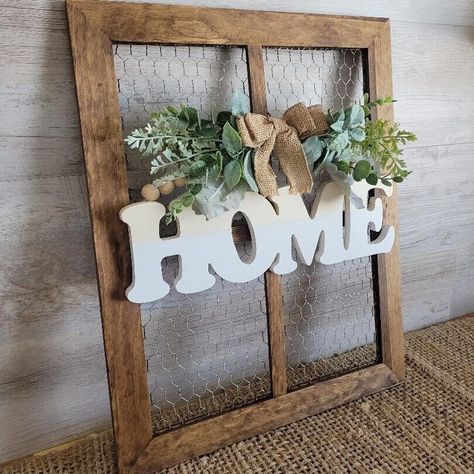 "This chicken wire frame with a beaded wood sign and mini swag will be a definite conversational piece! A cute way to decorate your favorite wall or console table!  Attached is a saw tooth hook for hanging! Choose your own wood stain! Item measures: 16\" W x 20\" H x .6\" D Frame only is also available! As shown: Barnwood" Over Doorway Decor, Chicken Wire Frame Ideas, Old Window Picture Frame Diy, Dollar Tree Crafts Home Decor, Chicken Wire Frame Decor, Chicken Wire Bulletin Board, Farmhouse Bedroom Wall Decor, Chicken Wire Projects, Frame With Wreath