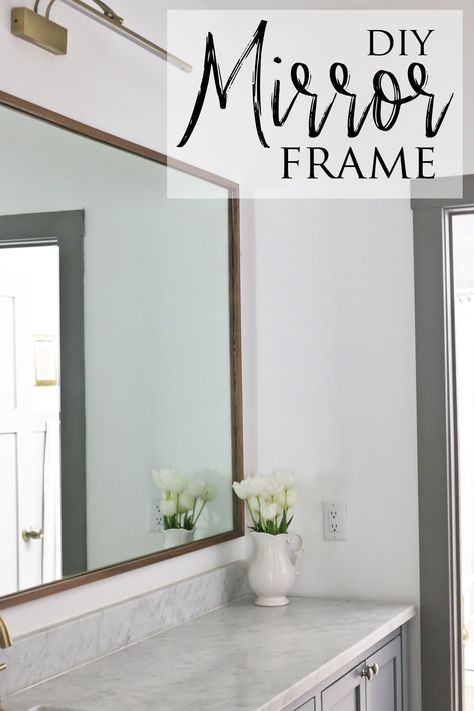 Discover this DIY wood mirror frame that saves you a ton of money and offers a beautiful custom look that just can't be bought in stores. For a relatively quick and easy DIY project, I think it made a huge impact on the design of this shared bathroom room in our pole barn house. Diy Wood Framed Mirror Bathroom, How To Add A Frame To A Bathroom Mirror, Diy Bathroom Framed Mirror, Mirror Surround Diy, Ideas To Frame A Bathroom Mirror, Making A Frame For A Mirror, Trim Mirror Bathroom Diy Frame, Updating Mirrors Frame, Adding Frame To Bathroom Mirror