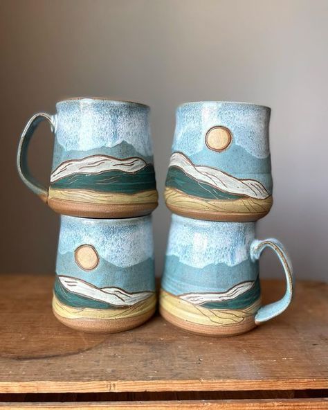 D Whigham Ceramics on Instagram: "Another round of Loess Hills mugs! I keep tweaking them just a little every time I make these. Really happy how the glaze turned out looking like hazy skies. . . . #dwhighamceramics #landscapeinspiration #landscapepottery #loesshills #iowaartist #wheelthrownceramics #mugmaker" Ceramic Mug Mountains, Underglazed Mug, Carving Pottery Mugs, Pottery Wheel Mug, Hand Thrown Pottery Ideas, Landscape Mug, Wheel Thrown Pottery Ideas Beginners, Ceramic Mug Shapes, Sgraffito Mug