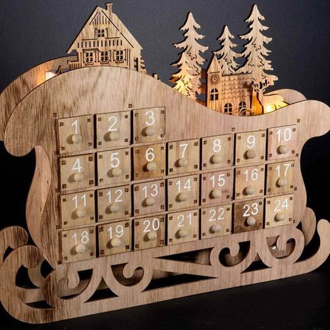 Advent calendars in laser-carved wooden sleigh with LED lights Size: CM 40 x 7 x 32.5 H Drawer interior: 2.6 x 4 x 2.9 H-works with 2 mini stylus batteries not included Usage: Calendar Laser Cut Wood Ornaments, Laser Cut Wood Projects, Santa On His Sleigh, Laser Cut Wood Jewelry, Tree Advent Calendar, Wooden Sleigh, Christmas Tree Advent Calendar, Xmas Gifts For Kids, Calendar Advent