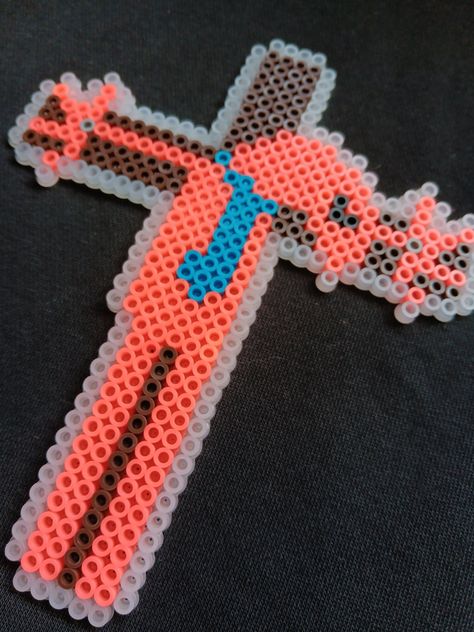 My original Allan from Smiling Friends perler bead design. I just thought crucified Allan was hilarious, so I had to make him. RIP, he just wanted his cheese. About 6 inches tall by 5 inches across. Perfect for breaking up gallery walls. All wall hangings can come instead as a magnet, if requested, either specify in order details, or email me. Perler Bead Patterns With Clear Beads, Shrimp Perler Beads, Yami Kawaii Perler Beads, Perler Bead Patterns Coster, Matching Pearler Beads, Twenty One Pilots Perler Beads, Kandi Patterns Pixel Art, Unique Pixel Art, Regular Show Perler Beads