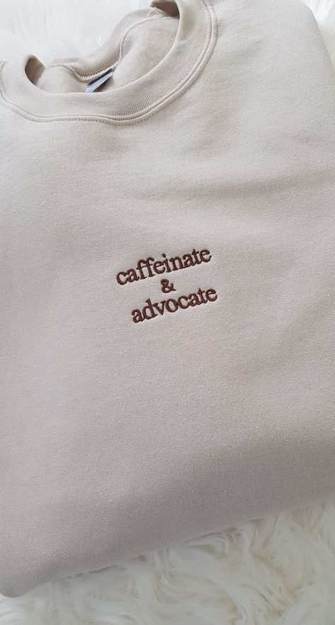 Show off your dedication and passion with our Embroidered Caffeinate And Advocate Awareness Crew. This crewneck sweatshirt is perfect for para professionals, special education teachers, social workers, and anyone who believes in equal rights and social justice. With its bold embroidery and empowering message, this sweatshirt serves as a reminder to stay caffeinated and advocate for important causes. Whether you're in the classroom, the office, or out in the community, this sweatshirt is a stylish way to showcase your commitment to making a difference. It also makes a thoughtful and meaningful gift for the feminist and advocate in your life. Stand up, speak out, and make a statement with this impactful crewneck sweatshirt. Our Gildan sweatshirt is made from a blend of 50% cotton and 50% pol Self Care Shirt Ideas, Embroidered Clothes Ideas, Gifts For Social Workers, Social Worker Outfits, Events Logo, Sport Events, Special Ed Teacher, Social Worker Gifts, T Shirt Prints