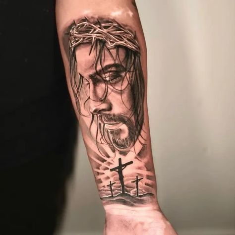 Black & Grey Jesus Christ Realistic Portrait Three Crosses Religious Tattoo Idea & Design on Men Forearm Half Sleeve Jesus Christ Three Crosses Tattoo Three Crosses Tattoo Forearm, Three Crosses Tattoo For Men, Three Crosses Tattoo Design, Jesus Forearm Tattoo, Three Crosses Tattoo, Crosses Tattoo, Religious Tattoo Sleeves, Religous Tattoo, Portrait Tattoo Sleeve