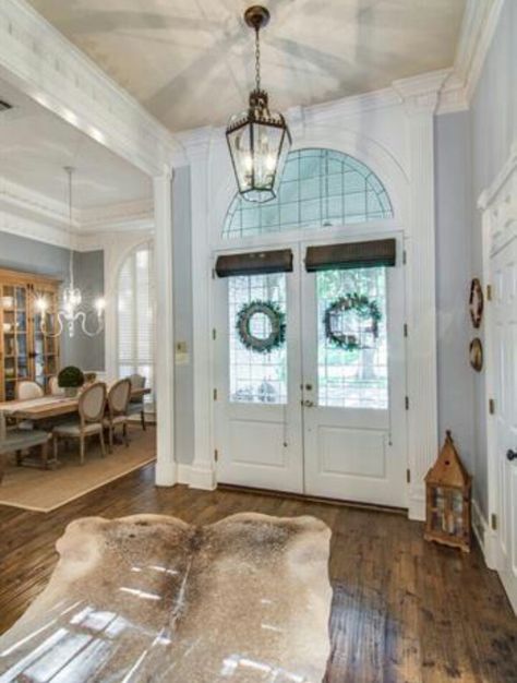 Entry way. Cow hide rug. Double doors. Foyer Ideas Entryway Double Doors, Entryway Ideas Double Doors Inside, Front Door Entry Into Kitchen, Double Door Foyer, Foyer Rug Ideas, Country Future, Kitchen Hearth Room, Entry Way Door, Kitchen Hearth