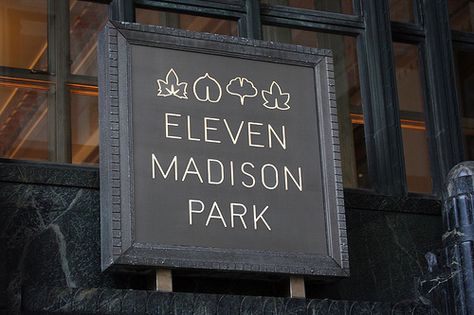 Eleven Madison Park | eleven-madison-park-sign 7 Eleven Logo, Station Eleven Book, Eleven Madison Park Food, 11 Madison Park Restaurant, Nomad Restaurant, Eleven Madison Park, Top 10 Restaurants, Landmarks Art, Nyc Park