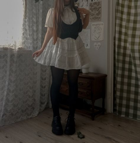 ootd outfit inspo cute cottagecore fairycore white dress black vest delicate simple spring Black Vest Over White Shirt, Fairycore White Dress, Fairy White Dress, Txt Concert, Outfit Inspo Cute, Cute Cottagecore, Concert Fit, Vest And Tie, Concert Fits