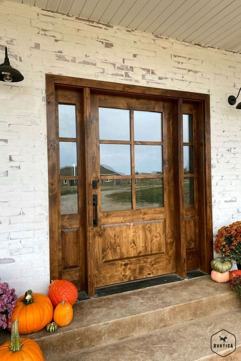 Capture the contemporary feel you’ve been searching for with the Boat House Front Door. This 6-lite front door offers amazing versatility in any style of home while ensuring ample amounts of natural light and warmth – ideal for beautiful sunny days. Whether you’re in the city, country, mountains or beach, our solid knotty alder lumber craftsmanship can be seen from every angle of this 6-lite door. Plus, we offer customizable options so you can pick your finish and texture. Knotty Alder Front Door With Sidelights, Modern Farmhouse Fiberglass Front Door, Rustic Front Door With Sidelights, Country Doors Farmhouse, Stunning Front Doors, Extra Wide Front Door Entrance, Oversized Front Door Farmhouse, Coastal Farmhouse Front Door, Barndominium Front Doors