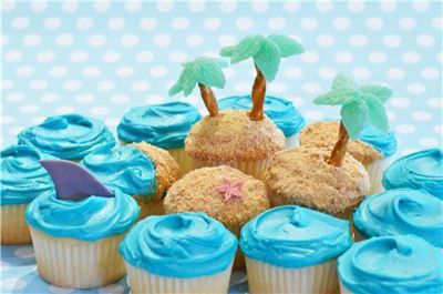 wave cupcakes | Found on michaels.com Island Cupcakes, Denver Aquarium, Tropical Cakes, Shark Cupcakes, Beach Cupcakes, Theme Cupcakes, Summer Cupcakes, Blue Icing, Pirate Island