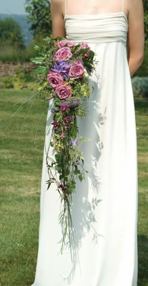 cascades are back Large Cascade Wedding Bouquet, Cascading Wedding Bouquets Lilies, Wildflower Cascade Bouquet, Cascading Orchid Wedding Bouquet, Garden Style Cascade Bouquet, Trailing Bouquet, Small Bridal Bouquets, Bridal Roses, Cascading Wedding Bouquets