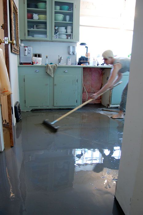 I was TERRIFIED to pour self levelling cement over my kitchen floor but after reading a ton about it online I did it. And it worked GREAT. Tutorial here. Cement Floor Diy, Cleaning Concrete Floors, Concrete Kitchen Floor, Concrete Floors Diy, Self Leveling Floor, Black Kitchen Cabinets, Concrete Kitchen, Countertop Design, Cement Floor