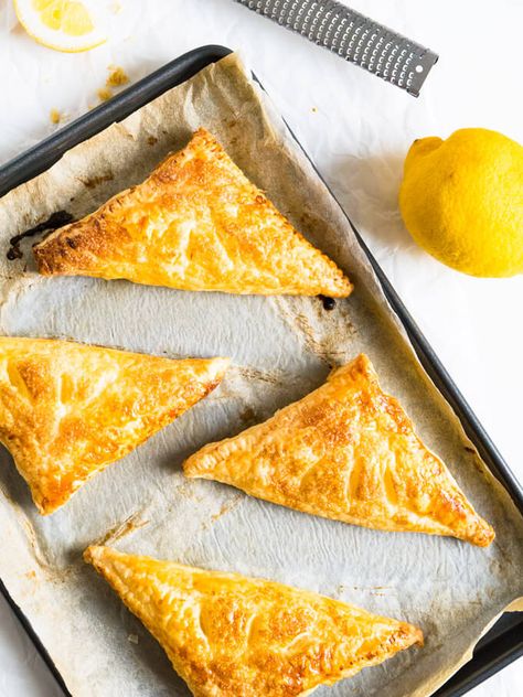 Lemon Puff Pastry Pockets are a perfect summer treat! Crispy caramelized puff pastry with a lemon & ricotta cheesecake filling. Lemon Puff Pastry, Cheese Curds Recipe, Puffy Pastry, Lemon Ricotta Cheesecake, Puff Pastry Pockets, Curd Recipes, Cheese Curd, Pizza Pies, Ricotta Cheesecake