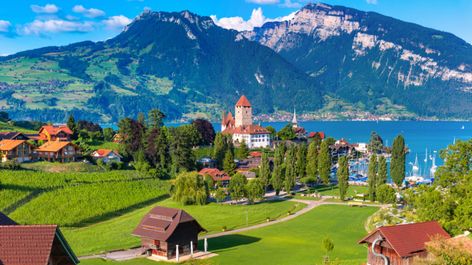 Take a break from urban life with a weekend spent in one of these idyllic mountain villages in Switzerland, from Appenzell to Zernez. Spiez Switzerland, Lake Thun, Lakeside Village, Photography Jobs, Up To The Sky, Old Churches, Mountain Village, Panoramic View, Fall Travel