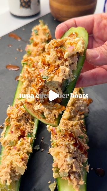 Arash Hashemi on Instagram: "TUNA CUCUMBER BOATS 🔥

If you missed meal prep, or you want to pull something together in no time that packs a ton of protein, try making this easy spicy tuna salad. It packs 51g protein and just 500 calories. I scooped it over a hollowed out English cucumber, but you can use lettuce, bell pepper, sourdough, or any type of vessel you wish!

Ingredients:
2 cans tuna (7oz total) in water
2 medium boiled eggs
1/2 jalapeño, finely diced (deseed if you want less heat)
1/4 cup finely diced dill pickles
1/2 small red onion, diced and soaked in water for 10 mins to mellow out the sharp flavor
1 tbsp Dijon mustard
1.5 tbsp mayo
1 tbsp sriracha or hot sauce
Salt & pepper to taste
1 English cucumber
1 tsp sesame seeds & chipotle hot sauce for garnish

Here is how I made Spicy Tuna Cucumber Boats, Tuna Cucumber Boats, Cucumber Crab Salad, Lemon Pepper Tuna Packet Recipes, Spicy Tuna Salad, Spicy Tuna, Low Carb Lunch, High Protein Recipes, Keto Recipes Easy