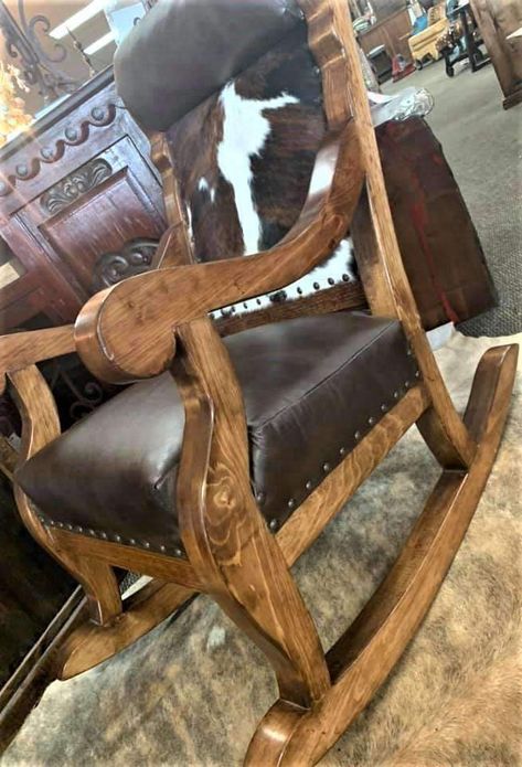 Our Dark Leather & Tri Color Cowhide Rocking Chair is beautifully hand crafted on a Ponderosa Pine frame that is stained and lacquered for years of beauty and durability. Customize your leather rocking chair to fit your decor style. You can pick your wood frame stain, leather, cowhide and nail head color. These western, rustic rocking chairs will fit beautifully in any western ranch, or rustic lodge style decorated space. Our heirloom quality handmade chairs coordinate well with many of our Western Rocking Chair, Southwestern Chairs, Leather Rocking Chair, Lodge Style Decorating, Western Chair, Cowhide Decor, Diy Furniture Upholstery, Ranch Furniture, Cowhide Chair