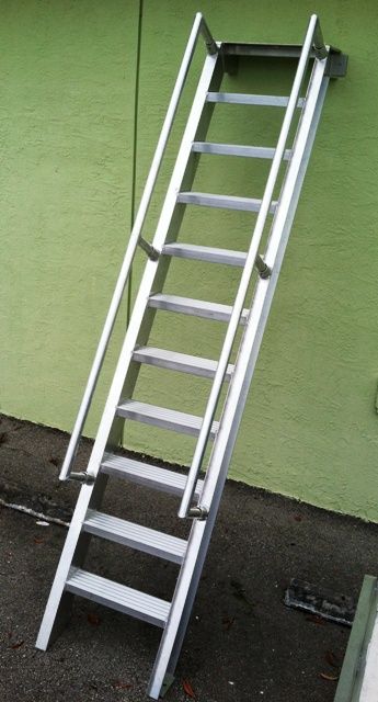 An aluminum ship's ladder. This aluminum ladder features 5" wide steps. #shipsladder #aluminumladder #marineladder Steel Ladder Design, Metal Ladder Ideas, Iron Ladder For Terrace, Iron Ladder, Ship Ladder, Steel Bed Design, Exterior Door Designs, Home Gate Design, Gate Wall Design