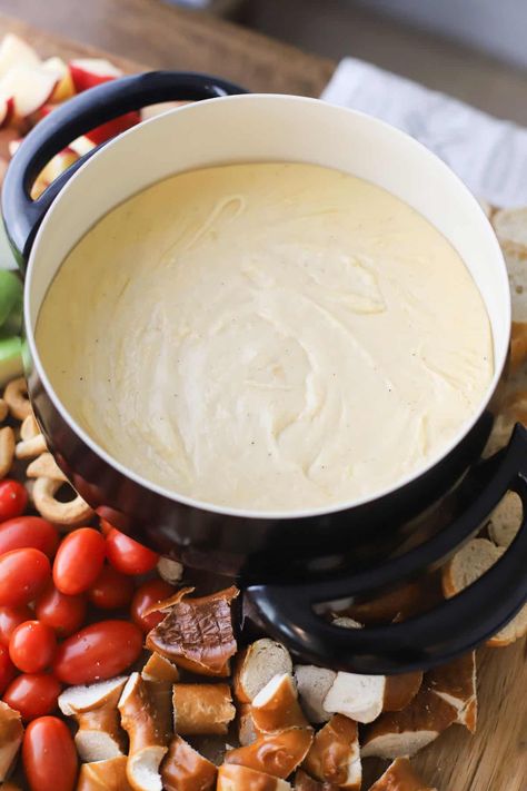 This Easy Cheese Fondue recipe with white wine is a great appetizer to enjoy at home for Valentine’s Day, game day, New Years Eve, or cozy date nights. You only need a few ingredients to make the most silky, smooth, delicious cheese fondue. #thecarefreekitchen #cheese #fondue #cheesefondue #appetizer #valentinesday #datenight #snacks Vegetarian Fondue Recipes, Cheese Fondue With Wine, Cougar Gold Cheese Recipes, Easy Cheese Fondue Recipes 3 Ingredients, Fondue Recipes Easy, Best Cheese Fondue Recipe, Cheese Fountain Recipe, Healthy Fondue, Fondue Date Night At Home