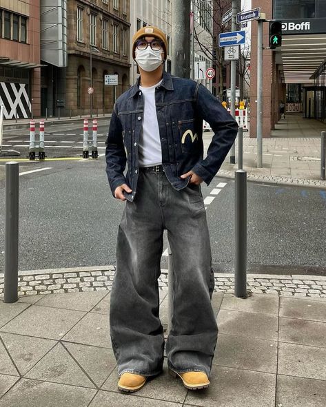 How about his color? 🛰️ 📸 @jira.exe 🇩🇪 🧢Hat : carhartt 👔Top : evisu 👖Bottom : trendtvision 👞Shoes : timberland Unlock the style with an “Evisu” deep blue denim printed jacket, layered over a white inner shirt for a classic touch. Paired with “Trendtvision” baggy gray jeans, the shirt is neatly tucked in for a polished look. Complete the ensemble with “Timberland” boots and top it off with a “Carhartt” yellow beanie for a pop of color. This outfit effortlessly blends streetwear vibes w... Deep Blue Jeans Outfit Men, Dark Blue Denim Jacket Outfit Men, Outfit Ideas With Jean Jacket, Boots And Baggy Jeans, Gray Denim Jeans Outfit, Gray Jacket Outfit, Outfit With Beanie, Gray Jeans Outfit, Blue Denim Outfit