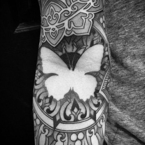 Cool negative space butterfly in a geometric sleeve Hai Tattoo, Mens Butterfly Tattoo, Butterfly Tattoo Cover Up, Negative Space Tattoo, Mandala Sleeve, Butterfly Tattoo On Shoulder, Butterfly Tattoo Meaning, Butterfly Back Tattoo, Tattoo Dotwork