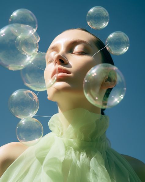 a girl is blowing bubbles down in the air Soap Bubbles Photography, Bubbles Photography, Future Society, Editorial Inspiration, Bored Board, Berry Lips, Beauty Photoshoot, Blowing Bubbles, Soap Bubbles