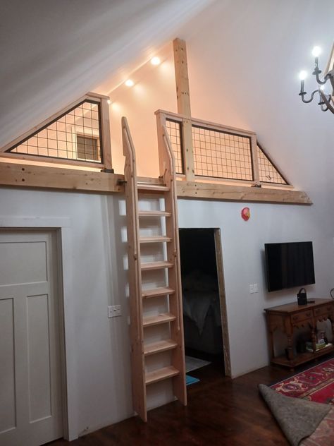 Loft Ladder Attached To Wall, Wood Railing For Loft, Pull Out Loft Ladder, Tiny House Loft Railing, Mezzanine Ladder Ideas, Ladder Loft Ideas, Stair Loft Ideas, Loft Safety Railing, Loft Railing Ideas Half Walls