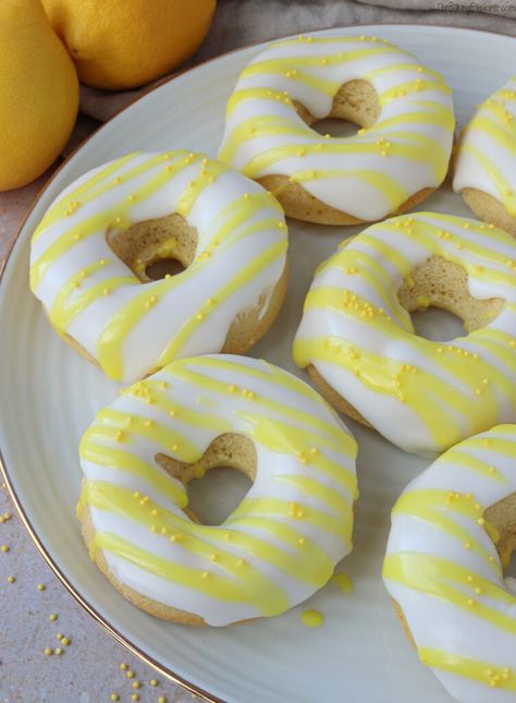 An easy to make recipe for light and zingy Lemon Baked Donuts, made in a donut pan and topped with lemon icing #thebakingexplorer #bakeddonuts #lemondonuts #easyrecipes #lighterbaking Lemon Curd Donut, Lemon Curd Cheesecake, Lemon Glazed Donuts, Yellow Desserts, Donut Pan, Ideal Lifestyle, Baked Donut Recipes, Easter Nests, Lemon Curd Filling