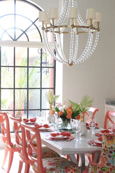 Coral inspired table top with an island flair. Florida Dining Room, Coral Dining Room, Tropical Airbnb, Rugs In Dining Room, Tropical Dining Room, Colorful Dining Room, Glam Chandelier, Colorful Coastal, Colorful Cottage