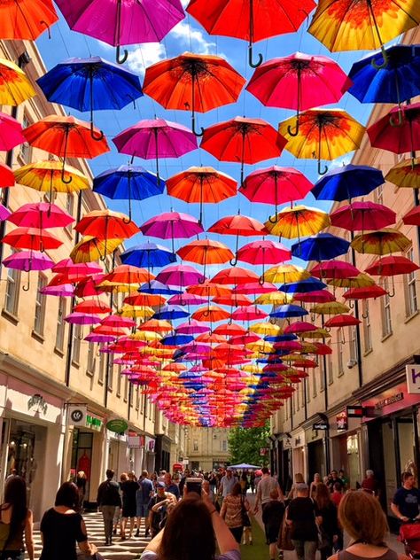 15 Photos That Will Make You Want to Add A Trip To Bath, England To Your Bucket List - She's On The Go Umbrella Alley, Umbrella Street, Umbrella Decorations, Colorful Umbrellas, Trip To Europe, Candy Land Christmas Decorations, Umbrella Art, Candy Land Christmas Decorations Outdoor, Candy Land Christmas Tree