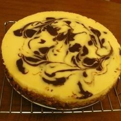 Orange Chocolate Swirl Cheesecake - Allrecipes.com Nanaimo Bar Cheesecake, Chocolate Swirl Cheesecake, Swirl Cheesecake, Chocolate Cheesecake Recipes, Orange Cake Recipe, Orange Chocolate, Chocolate Cream Cheese, Chocolate Swirl, Creamy Cheesecake