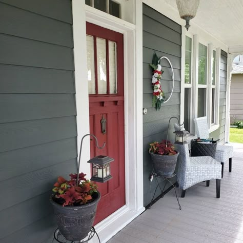 Gunmetal Gray siding, white trim, and red door (door color called passionate) Red Door Exterior House Colors, Door Colors For Gray House With Black Shutters, Grey Siding Door Color, Red Siding House, Red Trim House Exterior, Exterior House Colors With Red Doors, Red And White House, Painted Front Door Ideas Gray Siding, Exterior House Colors White Trim