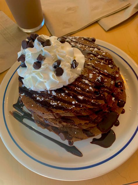 Chocolate chip pancakes topped with whip cream and chocolate chips and chocolate syrup Whip Cream Aesthetic, Chocolate Chip Pancakes Aesthetic, Ihop Pancakes Aesthetic, Ihop Chocolate Chip Pancakes, Pancakes Ihop, Ihop Food, Ihop Breakfast, Chocolate Chip Pancake, Pancakes Chocolate