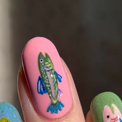 Audrey on Instagram: "I heard we’re doing fish girl summer, anchovy august, mackerel monday…

I was inspired by @allisondoesnails & @melly.k.nails after seeing their super cute fish nails! I had to join in on the fun. They were twins and I’m like the cousin you know you’re related to but you can’t remember how.

inspo: @allisondoesnails & @melly.k.nails & @lisabarlowillustrates 

🐟🐠🐡
• @bkind.products Sapa Valley*, Purple Hill*
• @crackedpolish Grotto*, Pistachio Buttah*
• @holotaco High Tea Hibiscus, Banana Hacks, Indigo Away, Modest Moss, Sweet Tooth
• @cirquecolors Pistachio
• @essie Muchi, Muchi*
• @zoyanailpolish Adeline
• @mooncat Do You Play Croquet?
• @by_vanessamolina True History
• Blue Frankenpolish

*PR/Gifted
#nailpolish #nailart #sardinesummer #freehandnailart #summernails Olive And Fish Nails, Fish Themed Nails, Banana Hacks, Tinned Fish Nails, Fish Nails Art, Nail Fish Design, K Nails, Fish Nail Art, Fish Nails