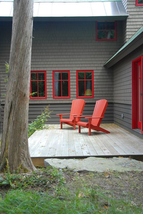 Adirondack Chairs for Easy Outdoor Living - Town & Country Living Dark Grey Houses, Rustic Deck, Red Windows, Gray House Exterior, Gray House, Deck Paint, Cabin Exterior, Cottage Exterior, Grey Houses