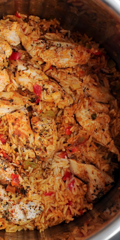 Cajun Instant Pot Chicken and Rice is a flavorful one pot meal! #instantpot #chicken #rice #spicy #cajun Ingredients:  olive oil 1 shallot (or small onion) diced 1 red bell pepper  1 green bell pepper  3 green scallions 3 cloves garlic 2 cups chicken stock  1 tablespoon tomato paste 2 tsp Cajun seasoning  1 tsp onion powder 1 tsp garlic powder 3/4 tsp sea salt 1.5 cup jasmine or basmati white rice 1 pound chicken breast Chicken Rice Bowls Instant Pot, Instant Pot Chicken And Peppers Recipes, Instant Pot Cajun Chicken And Rice, Instant Pot Cajun Rice, Creamy Chicken And Rice Instant Pot Recipes, Instapot Chicken Rice Recipes, Cajun Instant Pot Recipes, Instant Pot Recipes Low Sodium, Instant Pot Recipes Chicken And Rice