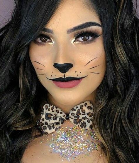 "Get ready to turn heads this Halloween with a fierce and stylish leopard costume! This wild and glamorous look is easy to create with a leopard print bodysuit, dress, or jumpsuit. Add cat ears, a tail, and leopard-inspired face makeup with bold eyeliner, whiskers, and spots to complete your transformation. Perfect for anyone looking for a fun yet fashionable costume, the leopard look is versatile and can be accessorized with dramatic nails, bold eye makeup, and statement heels. Cheetah Print Face Makeup, Cat Inspired Makeup, Cat Makeup Halloween Pretty, Cat Eye Makeup Halloween, Leopard Makeup Halloween, Leopard Halloween Costume, Cat Costume Makeup, Halloween Women Makeup, Black Cat Makeup