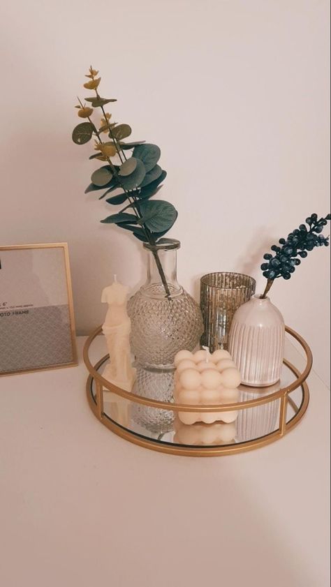 Gold mirrored tray holding 3 vases, two of them containing faux plants, and two unique candles. Decor Ideas Bedroom, Deco Studio, Bed Design Modern, Bedroom Deco, Dekorasi Kamar Tidur, Cozy Room Decor, Decor Home Living Room, Cute Room Decor, Room Inspiration Bedroom