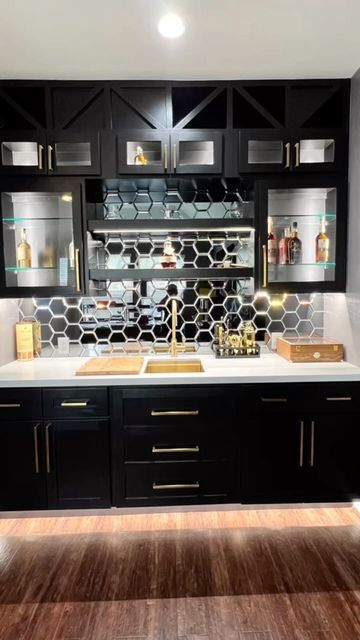 Black And Gold Wet Bar, Home Bar Mirror Backsplash, Black Bar Cabinets Modern, Bar Cabinet Lighting, Mirror Backsplash Bar, Black Wet Bar, Speakeasy Ideas, Basement Bar Ideas On A Budget, Basement Speakeasy