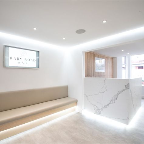 White marble counters, dental practice lobby, check in, dentist lobby Dentist Interior Design, Luxury Dental Clinic Design, White Dental Clinic, Dentist Photography, Interior Design White, White Laminate Flooring, Minimalist Reception, Marble Office, Brand Interior