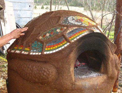 This gorgeous turtle-shaped oven, seen on Mud for Everyone, is built with local clays and grasses and beautifully embellished with a mosaic design on the shell. Cob Pizza Oven, Cob Oven, Cob Building, Casa Hobbit, Diy Pizza Oven, Oven Design, Four A Pizza, Earthship Home, Bread Oven