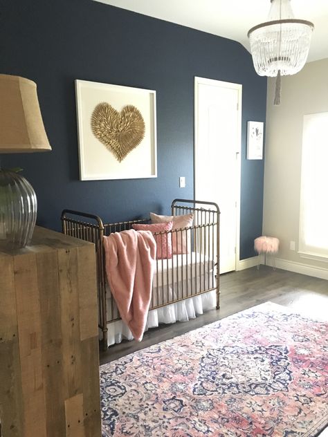 Navy and blush nursery with gold crib, gold feathered heart wall art and vintage Persian rug. Navy Star Nursery, Navy And Mauve Nursery, Navy Wall Accent, Navy Wall Nursery, Navy Blush Nursery, Pink And Navy Blue Nursery, Extravagant Nursery, Navy Blue Nursery Girl, Navy Blue And Pink Nursery