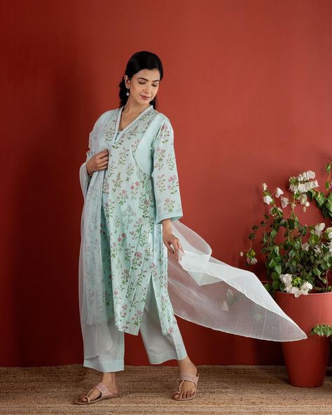 Summer 2024 - New Arrivals! The elegant colours and easy silhouette of our Blue Botanical Kurta evoke a feeling of summer relaxation. The calming beauty of the baby blue is accentuated with elegant botanicals scattered across the canvas in soft shades of pink and green. [ Cottons Jaipur, Cotton, Floral, Botanical floral, Handmade Kurtas, Everyday-wear, Summer staples ] #cottons #cottonsjaipur #newarrivals #floral #summer #summer2024 #handcraftedkurtas #comfortfits #cottonsuitset #summerti... Cottons Jaipur, Elegant Colours, Easy Silhouette, Fashion Sketches Dresses, Sketches Dresses, Instagram Summer, Summer Staples, Pakistani Outfits, Floral Botanical