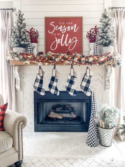 Christmas mantel decor ideas using buffalo check! Whether it's Christmas stockings hung by the chimney with care or any other holiday craft that you want to make, Wilshire Collections can inspire your holiday crafting and decor. Christmas Mantle Signs, Farmhouse Christmas Mantels, Buffalo Plaid Christmas Mantle, Christmas Hearth Decor, Farmhouse Christmas Fireplace, Christmas Decor Mantle, Wilshire Collections, Christmas Mantel Decor, Outside Christmas Decorations