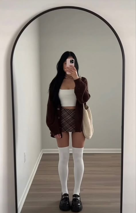 White Socks Outfit Aesthetic, Plaid Skirt Cardigan Outfit, White Tank Top Fall Outfit, How To Style Brown Plaid Skirt, Plaid School Skirt Outfits, Brown And White Skirt Outfit, Loafers With Long Socks, Brown Checked Skirt Outfit, Brown Skirt White Top Outfit