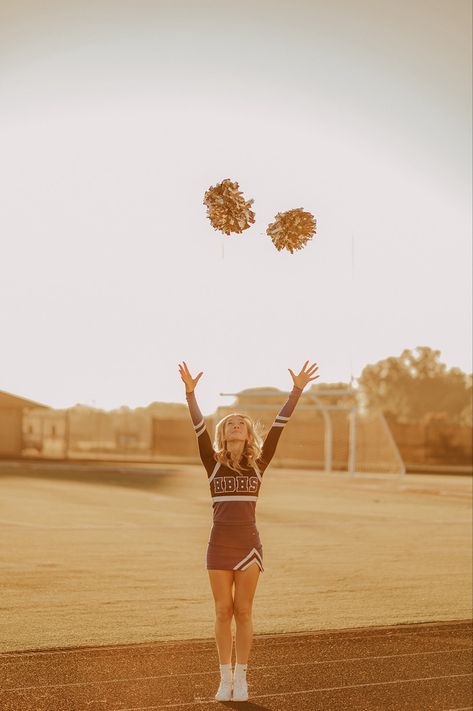 Tossing pom poms cheer Senior photo pose, golden hour photos, cheerleader Senior photos Football Cheer Pictures, Senior Picture Ideas Cheer, Cheer Pictures Poses, Cheerleading Photoshoot, Cheer Poses Individual Photo Ideas, Cheer Senior Pictures, Ballet Senior Pictures, Cheerleader Poses, Cheerleading Senior Pictures