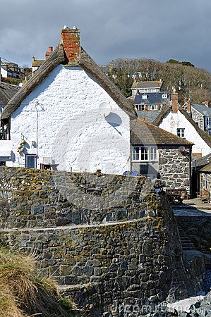 Spring sunshine bathes the whitewashed walls of the thatched cottages clustered around the small inlet of Cadgwith Cove on the Lizard peninsula in Cornwall Places In Cornwall, England Landscape, Armchair Travel, Spring Sunshine, Irish Countryside, The Lizard, Living In Europe, Thatched Cottage, Cornwall England