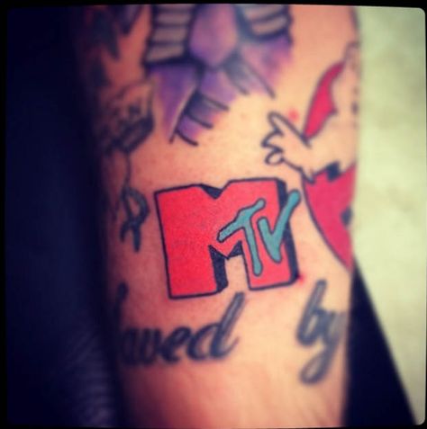 On August 1, 1981 at 12:01 am American cultural history was forever changed when MTV went on the air for the very first time. Over the next 35 years MTV would have an enormous impact on every aspect of our lives, most importantly on what was considered cool.  #inked #inkedmag #tattoo #mtv #music #Love #ink #art Mtv Tattoo, 80s Tattoo Ideas, Nostalgia Tattoo, 90s Tattoos, Tattoos 2024, Mtv Music, 2 Chainz, Pop Icons, Sleeve Ideas