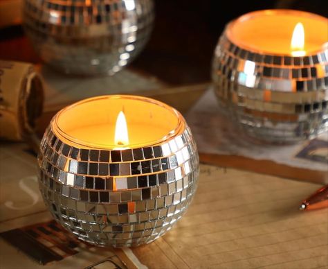 These adorable silver disco ball soy candles are nice for various occasions like weddings, 70s themed disco parties, birthdays, or home decor; Their shimmering design and warm glow create a captivating ambiance; Besides being beautiful decor pieces and sources of fragrance, these disco ball candles can be effectively applied for candle storage. Disco Ball Candle Centerpiece, Disco Ball Candle, Mini Disco Ball Room Decor, Cheap Disco Balls, Small Disco Ball, 70s Disco Party, Disco Party Decorations, Ball Candles, 70s Disco